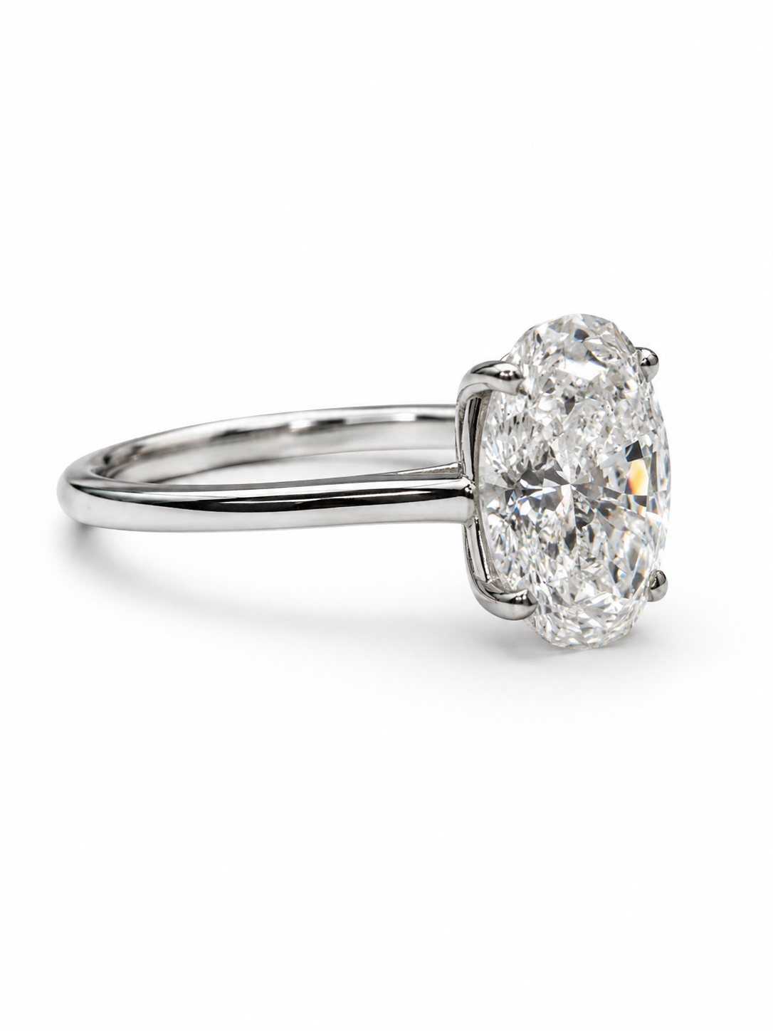 Close-up of Baelith Crest Oval Lab Diamond Classic Solitaire Ring set in 18K White Gold by Fiona Diamonds