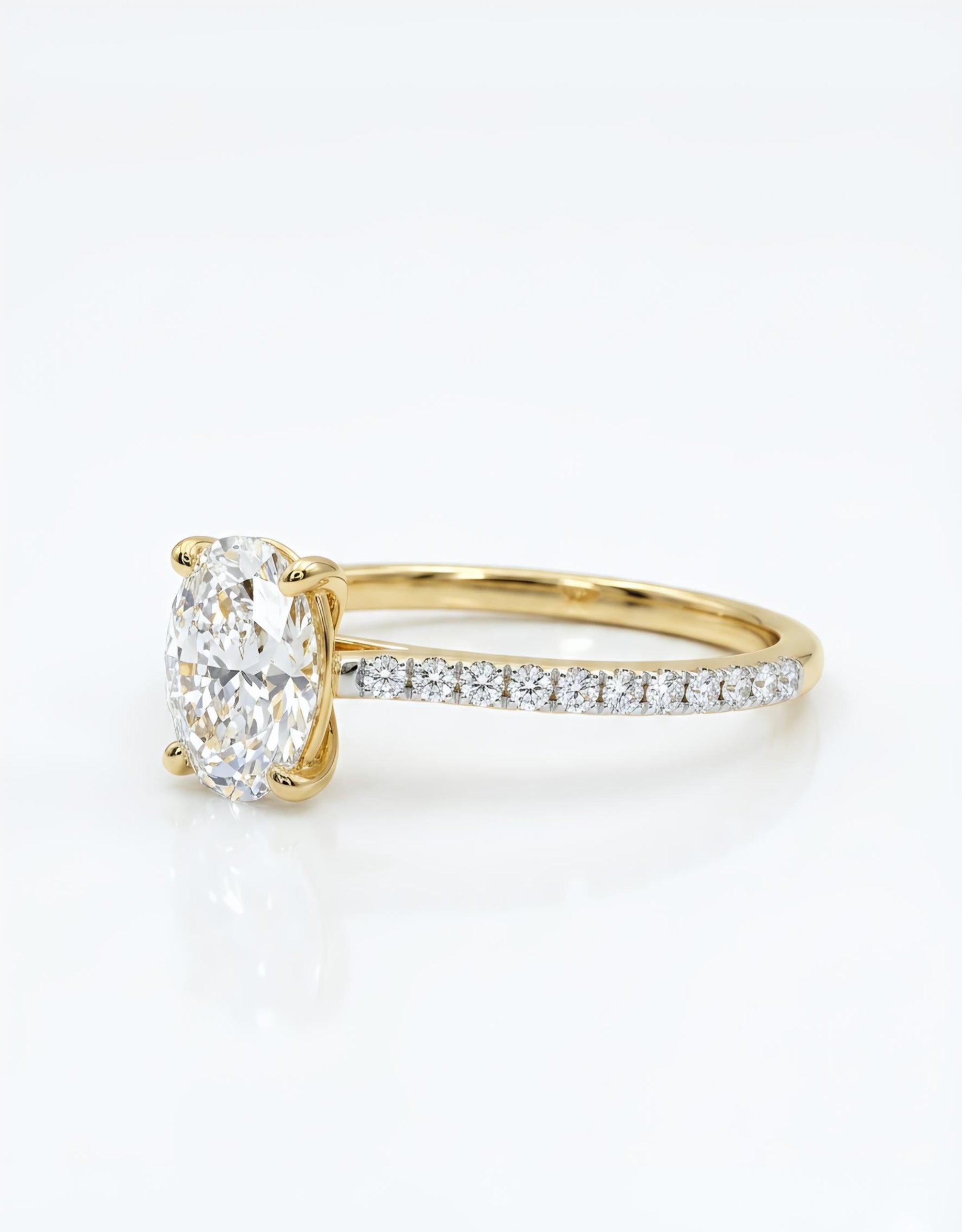 Close-up of Idris Flare Oval Lab Diamond Side Stone Solitaire Ring set in 14K Yellow Gold by Fiona Diamonds