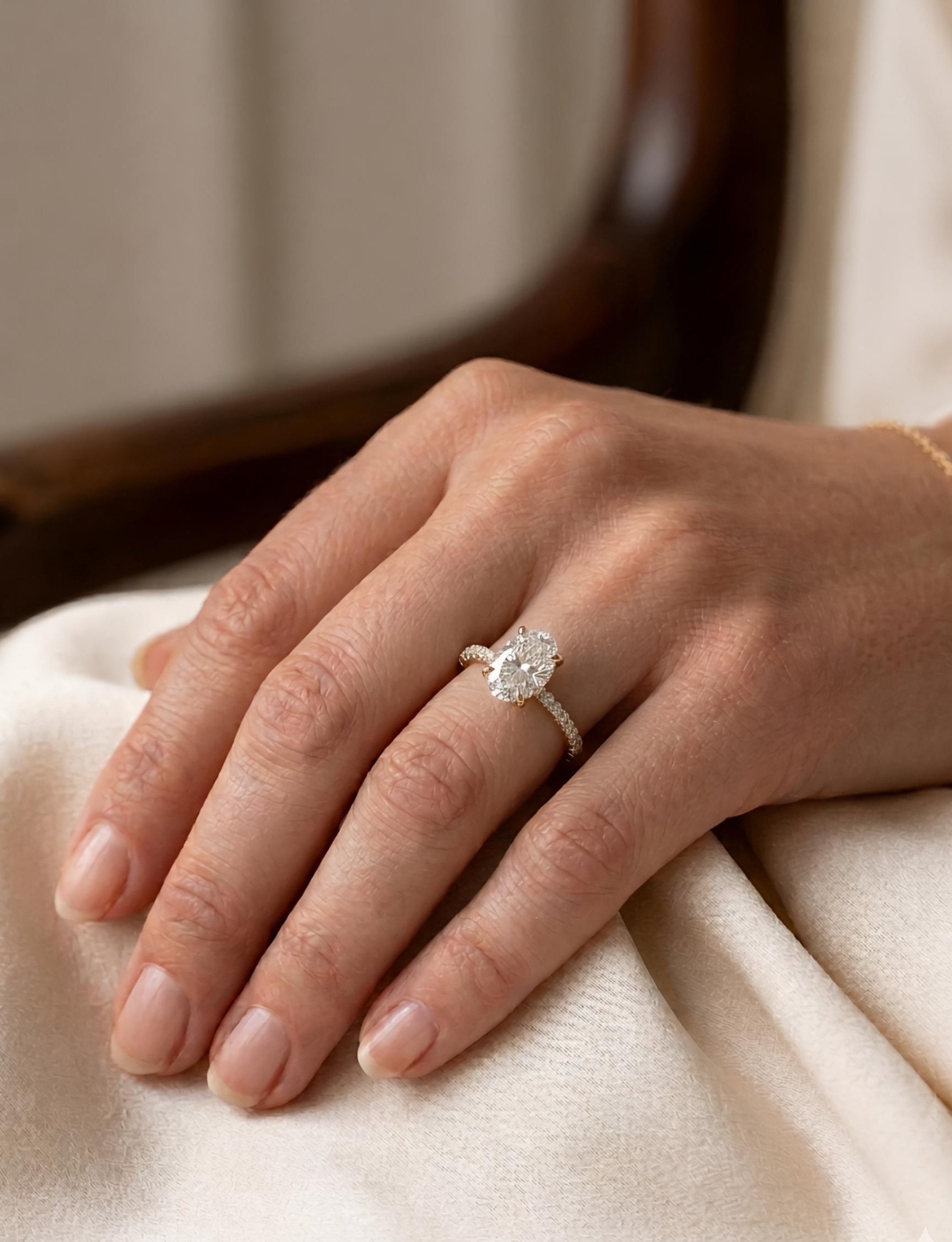 Side view of Idris Flare Oval Lab Diamond Side Stone Solitaire Ring in 14K Yellow Gold  Fiona Diamonds