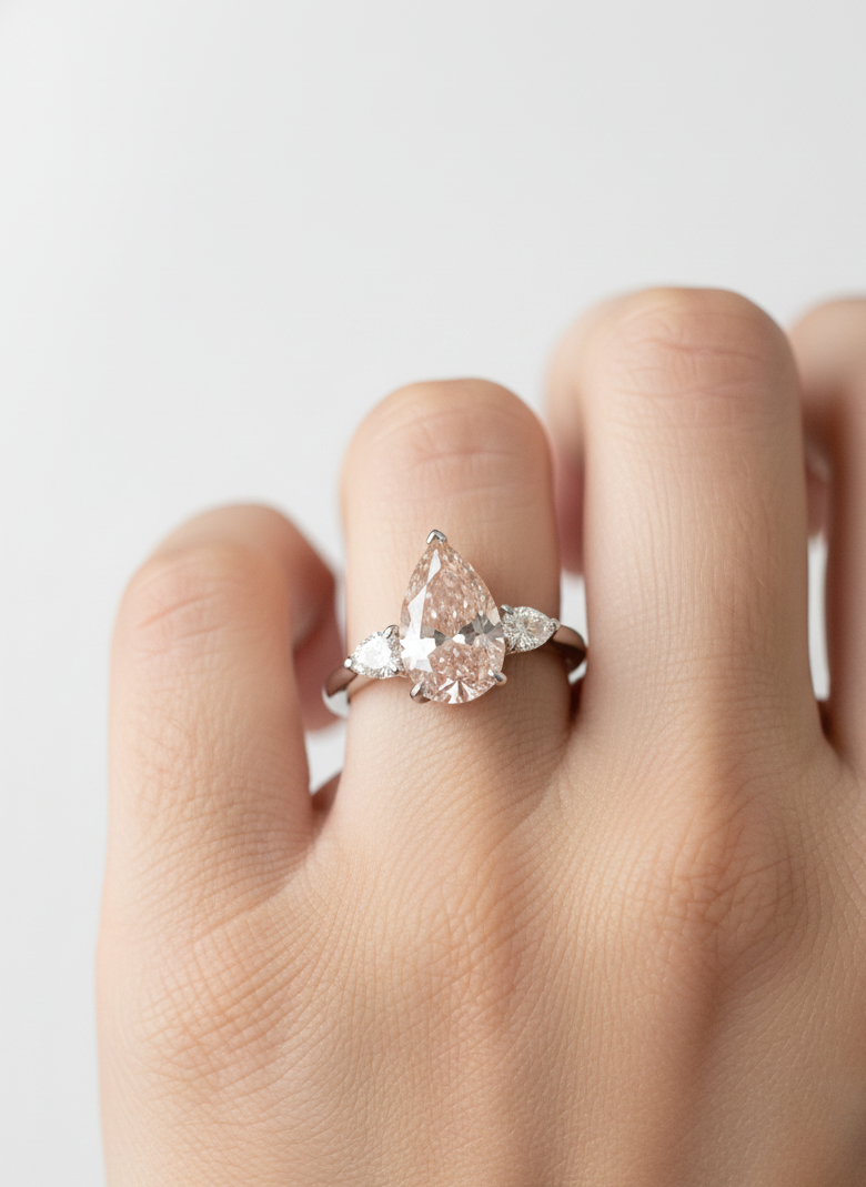 Close-up of Majesty 2.5ct Pear Lab Diamond Three Stone Ring set in 14K White Gold by Fiona Diamonds