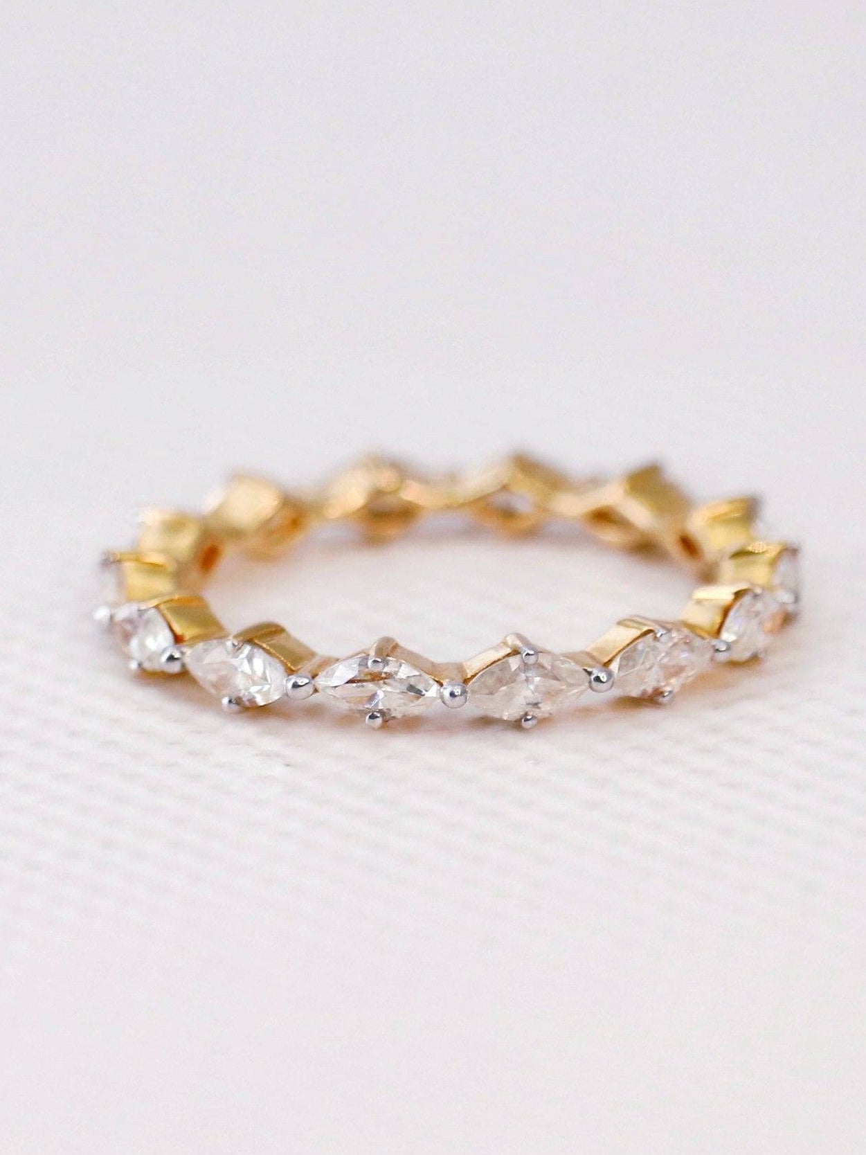 Close-up of Marvel Marquise Lab Diamond Eternity Ring set in 14K Yellow Gold by Fiona Diamonds