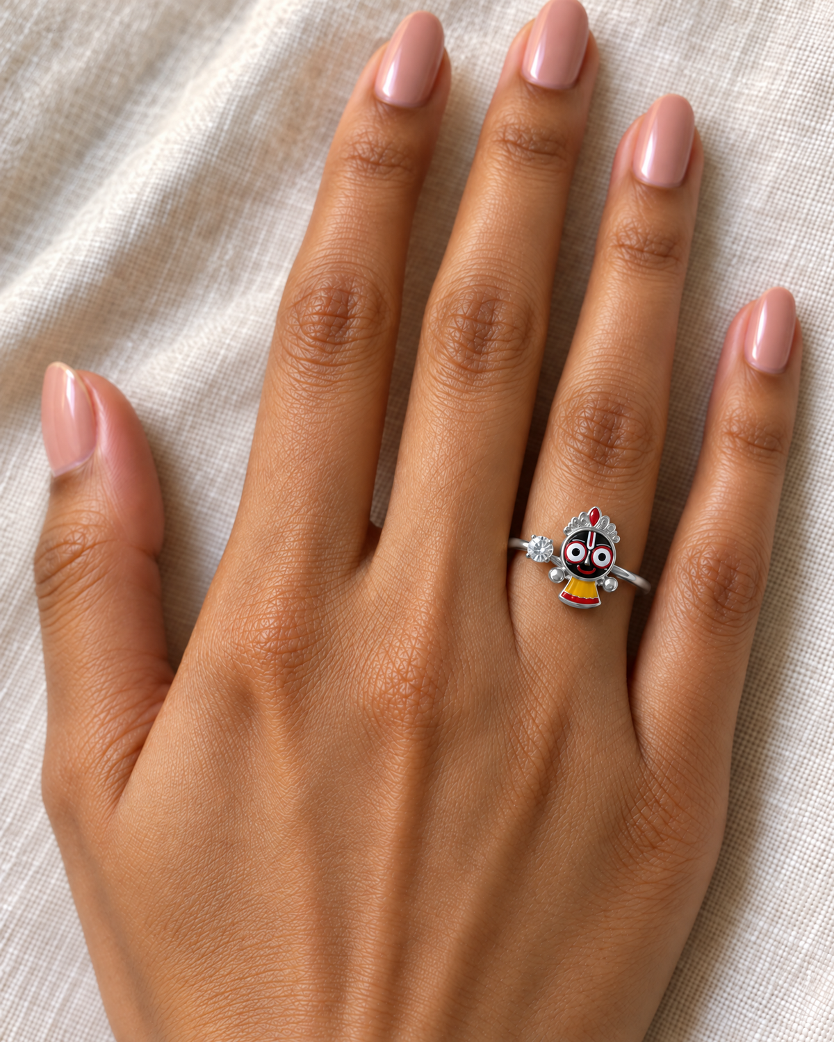 Jagannath Chakadola ring in polished 925 sterling silver – full-figure Jagannath with lab grown diamond solitaire, worn on the ring finger