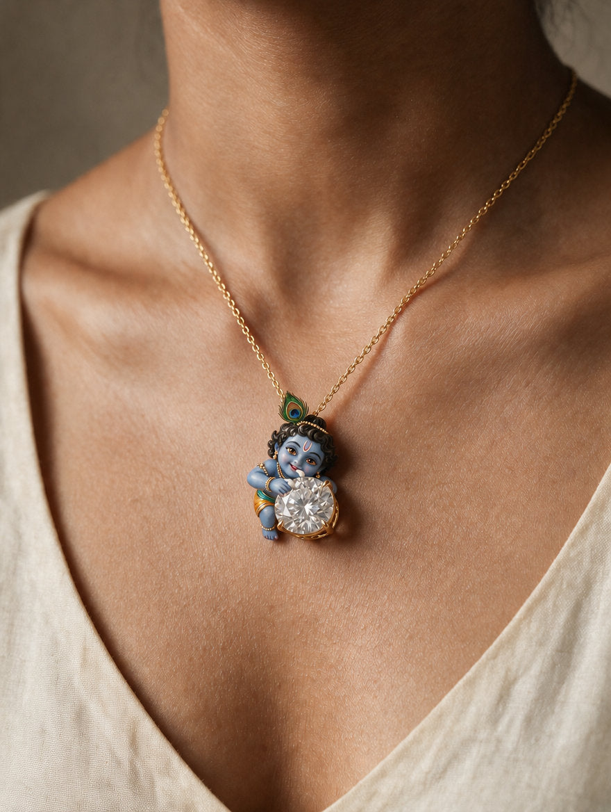 Murli Manohar — enamel Bal Krishna seated behind the diamond, tongue-in-cheek, round lab-grown diamond pendant in yellow gold, Fiona Diamonds