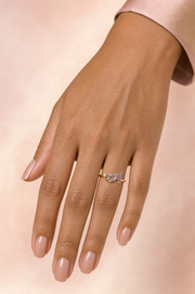 Mireya Stretching ring – lilac enamel baby elephant in a playful stretch holding a lab grown diamond solitaire with its trunk, worn on the ring finger