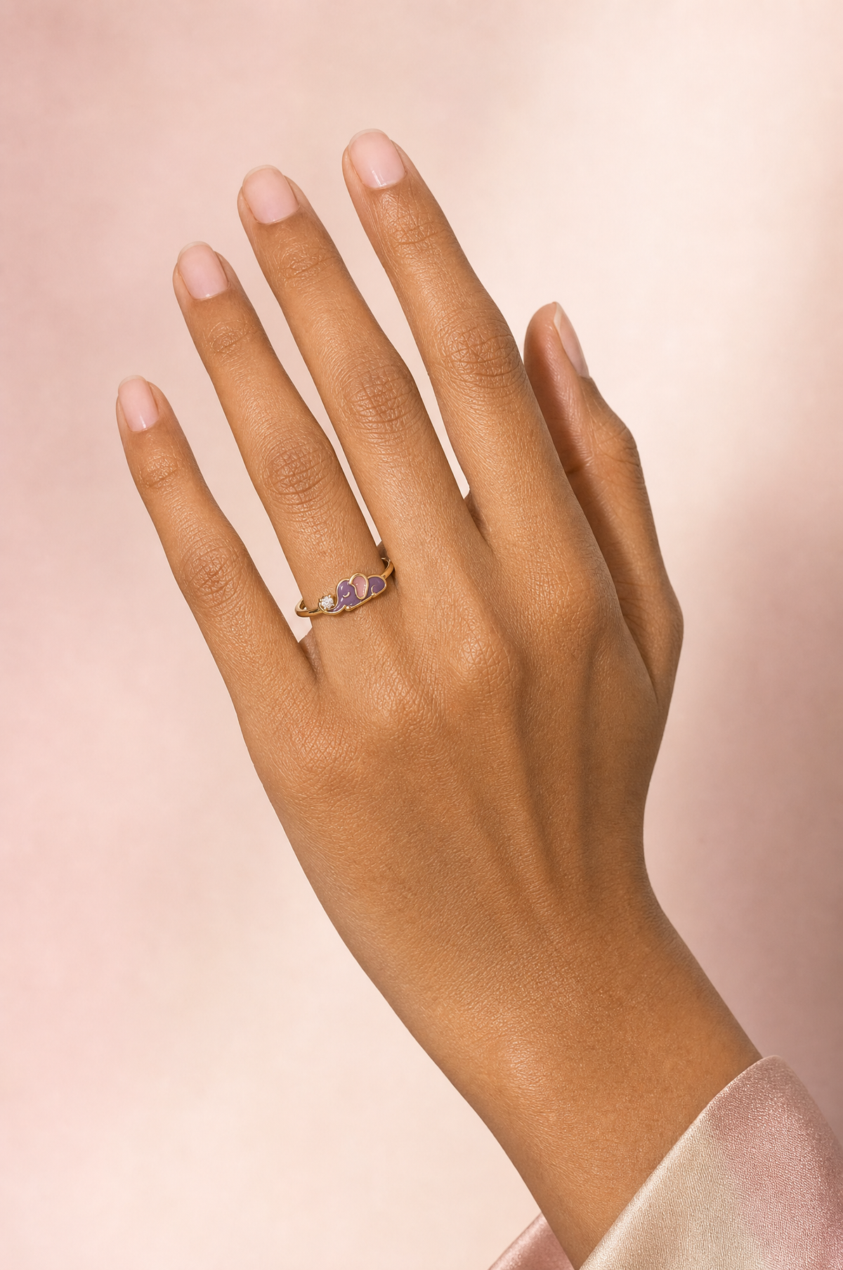 Nelisa Snoozing ring – lilac enamel baby elephant asleep with eyes closed beside a lab grown diamond solitaire, worn on the ring finger