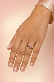 Kaveri Lucky Trunk ring – lilac enamel baby elephant with raised trunk holding a lab grown diamond, second diamond beside it, worn on the ring finger