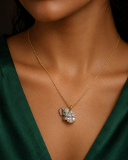 Peeping elephant lab grown diamond pendant in gold - pear cut solitaire with hand-enamelled grey elephant, pink inner ear and emerald eye - Fiona Diamonds
