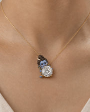 Chandrashekhar — enamel Bal Shiva watching over the diamond with the crescent moon in his jata, round lab-grown diamond pendant in yellow gold, Fiona Diamonds