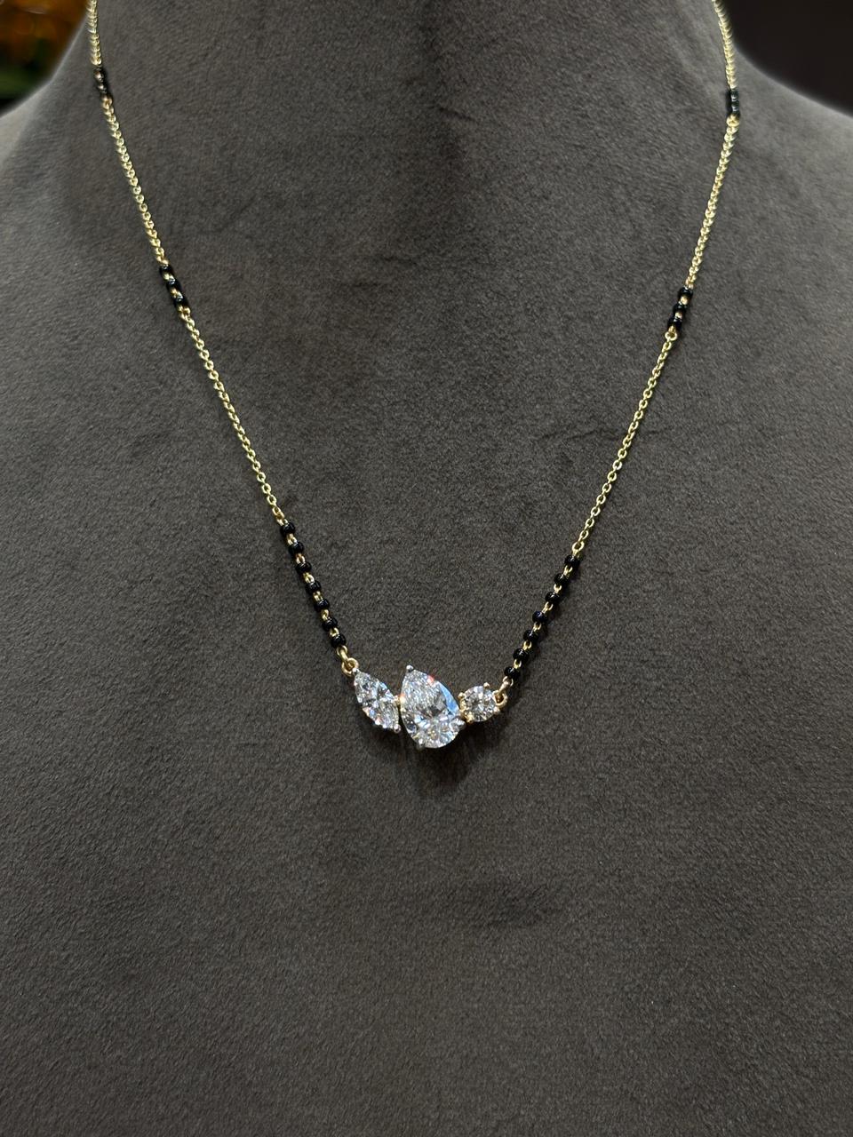 Close-up of Hollow Trace Pear Lab Diamond Mangalsutra in 18K Yellow Gold by Fiona Diamonds
