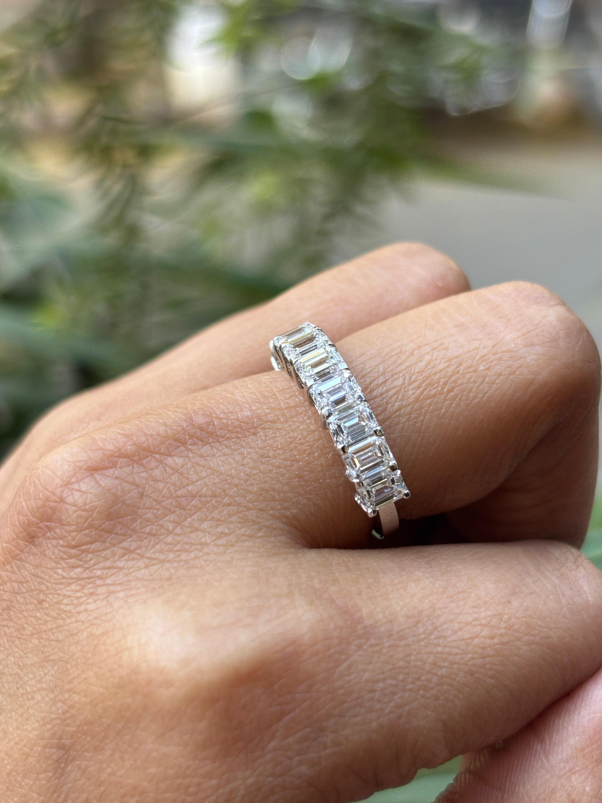 Fiona Diamonds Ulivra Emerald Lab Diamond Eternity Ring in 18K White Gold on hand