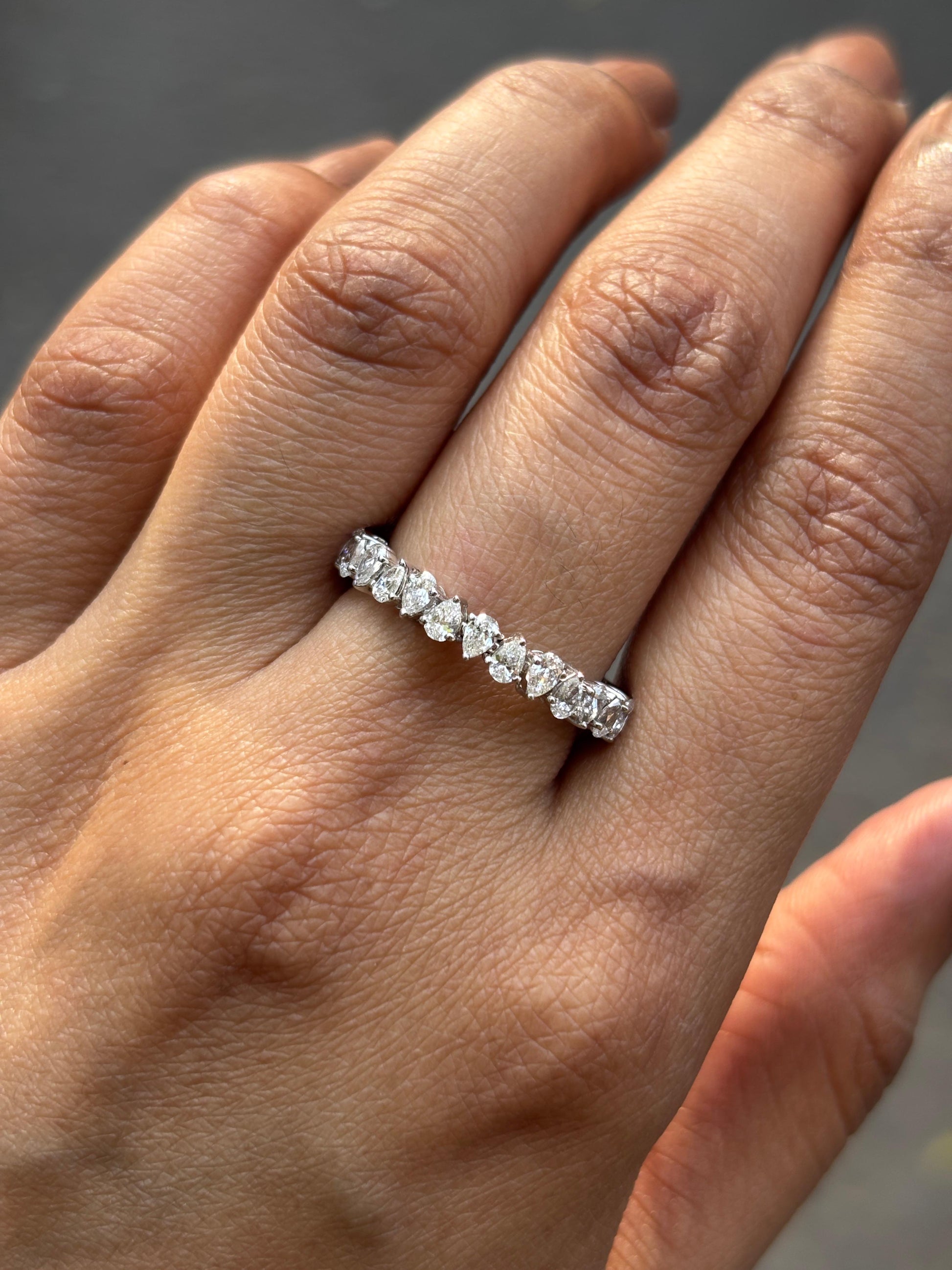 Close-up of Ione Pear Lab Diamond Eternity Ring set in 14K White Gold by Fiona Diamonds