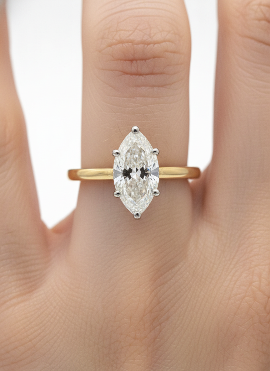 Close-up of Fable Crown Marquise Lab Diamond Classic Solitaire Ring set in 18K Yellow Gold by Fiona Diamonds