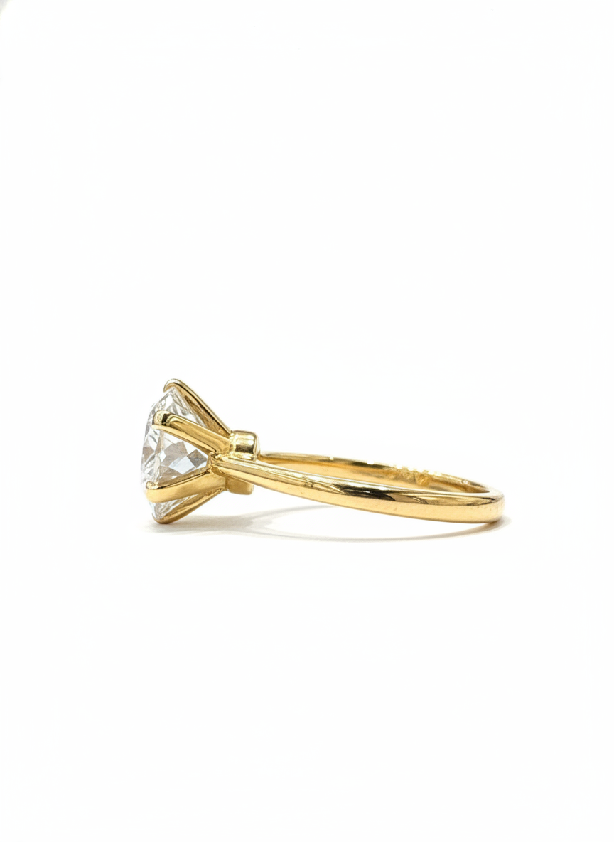 Close-up of Veil Eternity Round Lab Diamond Classic Solitaire Ring set in 18K Yellow Gold by Fiona Diamonds