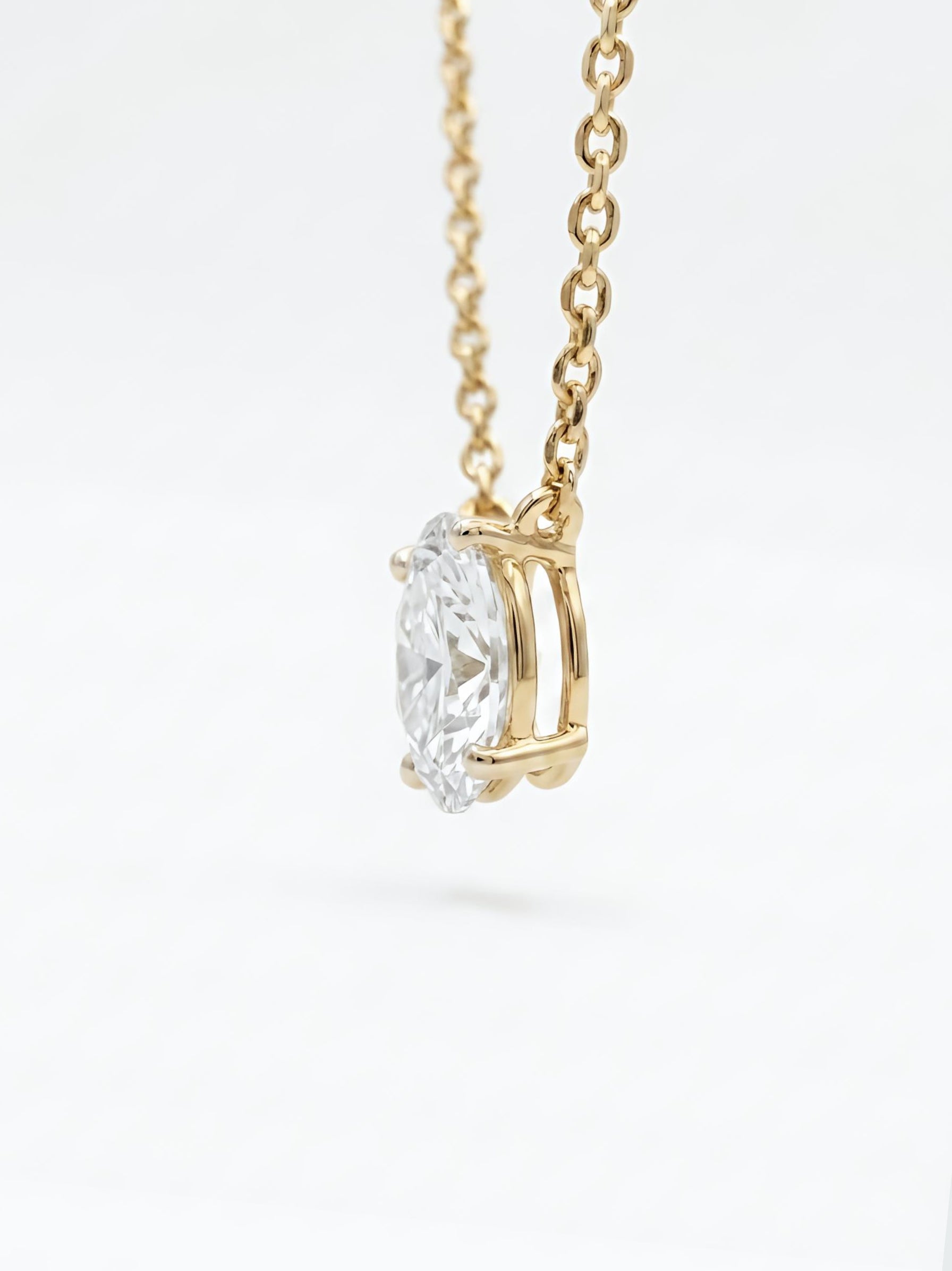 Close-up of Solen Vex Oval Lab Diamond Solitaire Pendant in 14K Yellow Gold by Fiona Diamonds