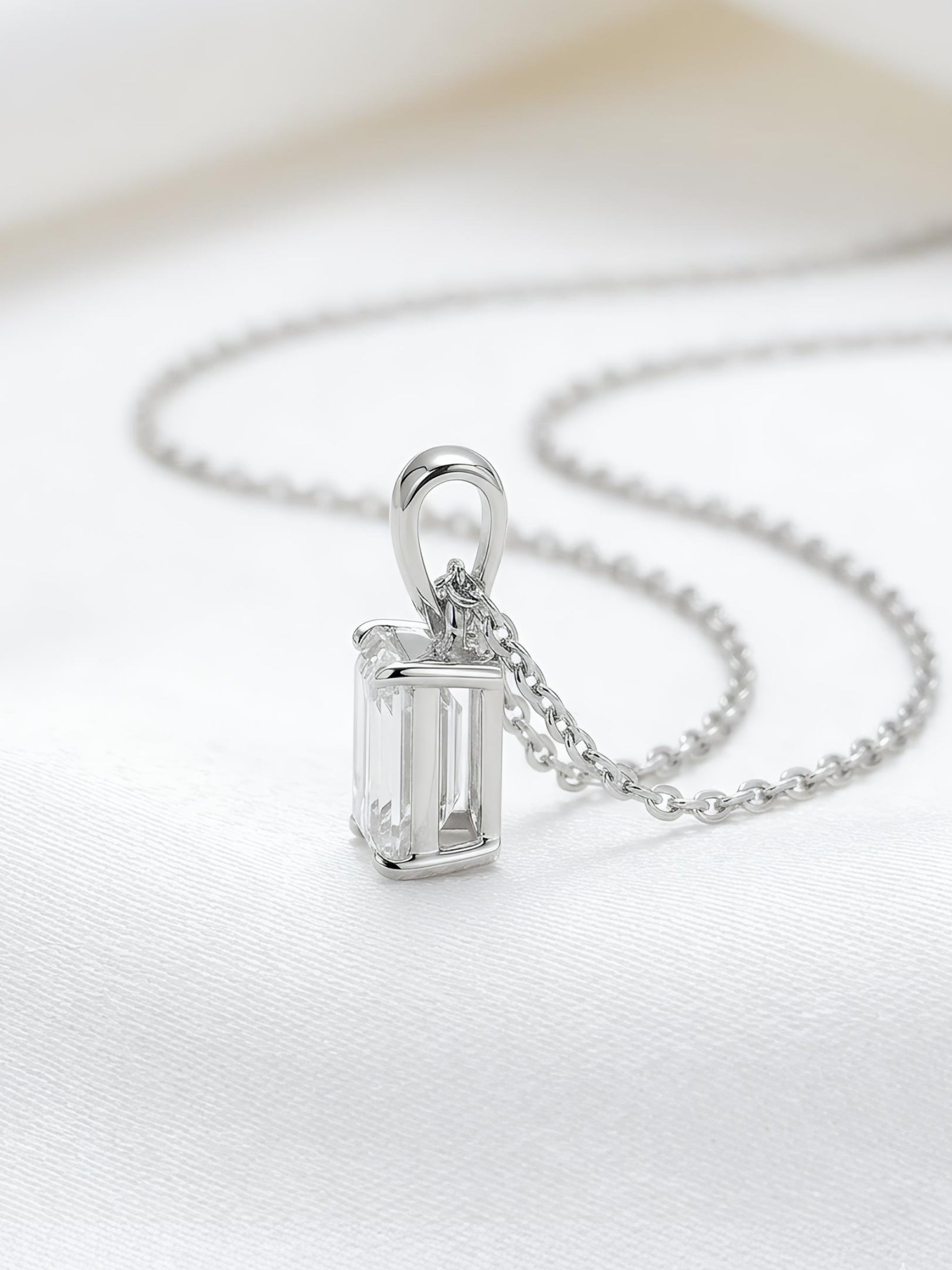 Close-up of Fable Lore Emerald Lab Diamond Solitaire Pendant in 9K White Gold by Fiona Diamonds
