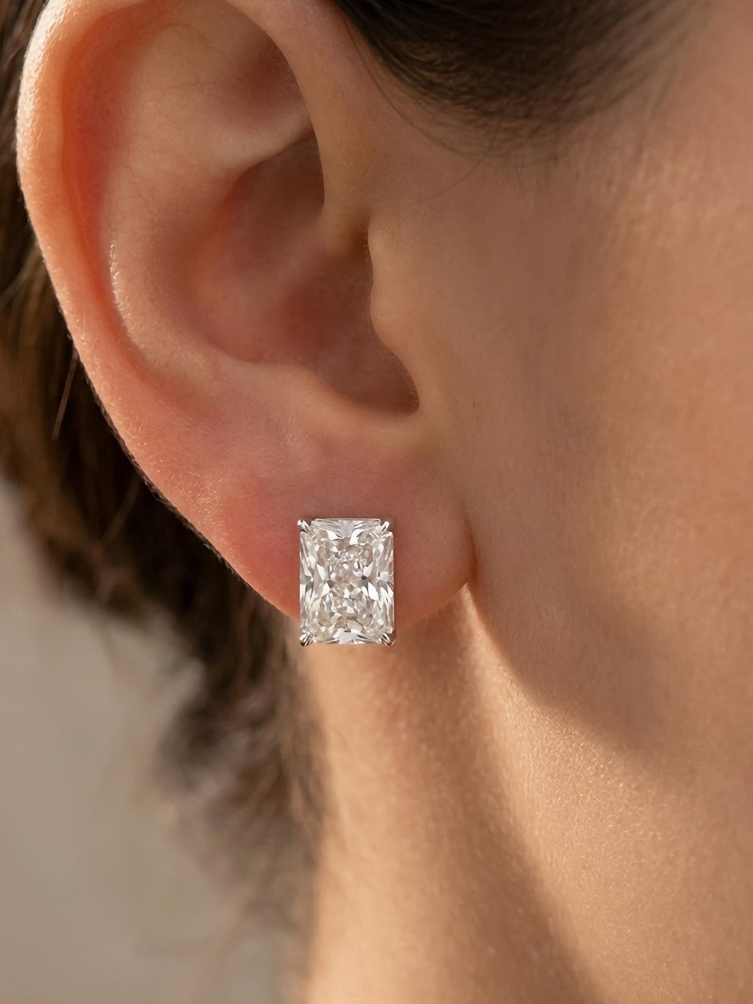 Close-up of 5ct Radiant Radiant Lab Diamond Solitaire Stud in 18K Yellow Gold by Fiona Diamonds