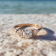 Ashy lab grown diamond ring with threes solitaires and thin band design Fiona Diamonds