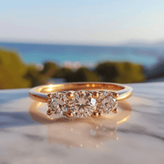 Aksha lab grown diamond ring with threes solitaires and thin band design Fiona Diamonds